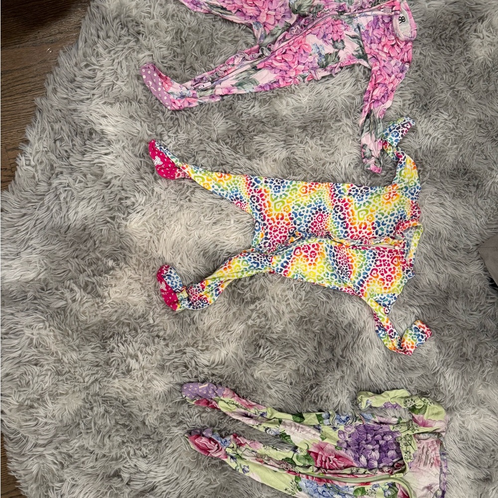 2 Posh Peanut Pink and Purple Floral and Bums and Roses sleepers size  0-3